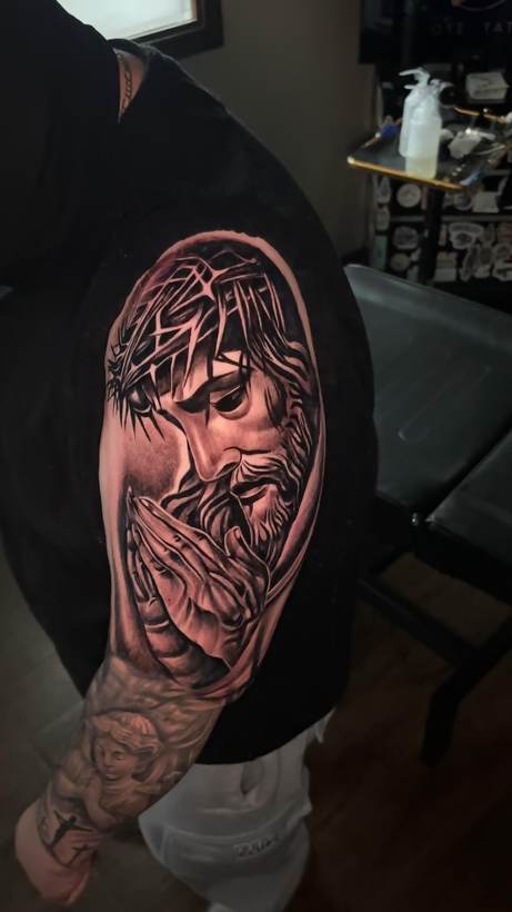 Black and grey portrait sleeve tattooed at Thorn and Oath